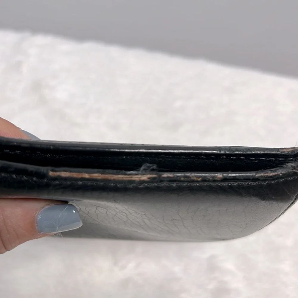 Tumi black leather